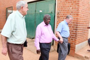 Brother Victor walks on the grounds of the College Tutazamie where he served as Headmaster (Prefect) and where he was taught by the Brothers. Brother David Mahoney (left) walks with him and Brother Larry Harvey holds his hand.